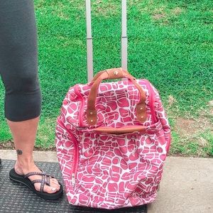 pink and white dejuno travel bag with wheels